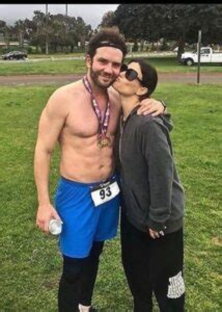 Aaron Lohr as seen shirtless in a picture with Idina Menzel