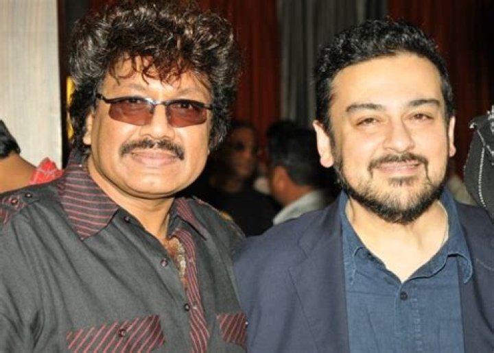 Adnan Sami (Right) smiling for a picture alongside Shravan