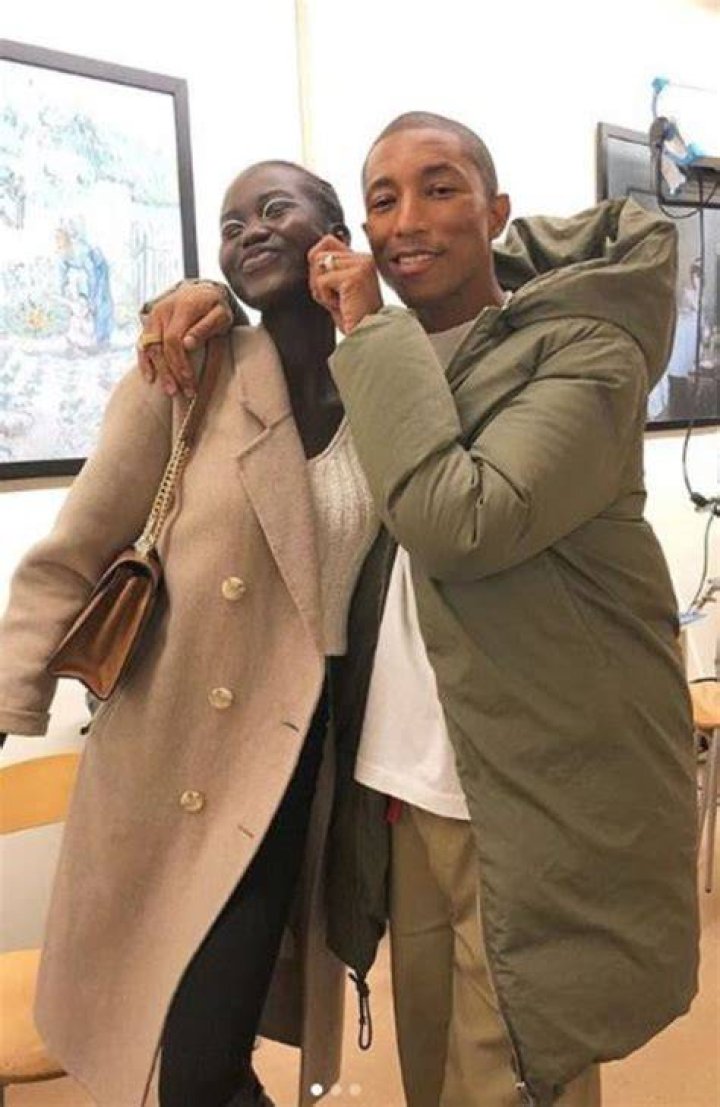 Adut Akech with Pharrell Williams in Decemeber 2018