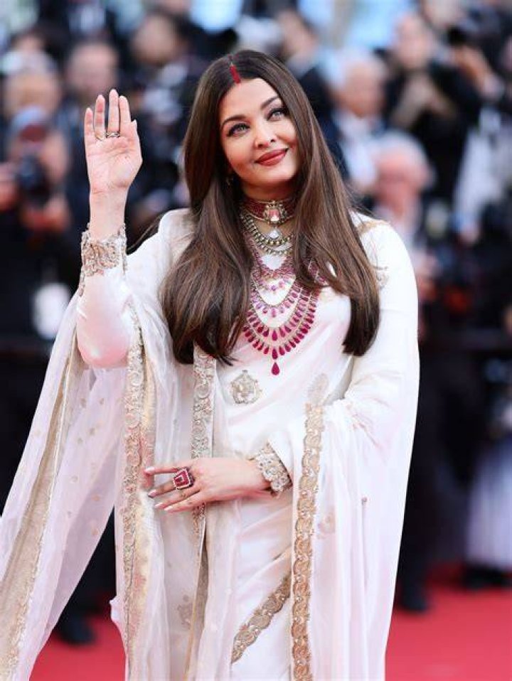 Aishwarya Rai posing with Manish after walking for the designer at the HDIL India Couture Week 2010