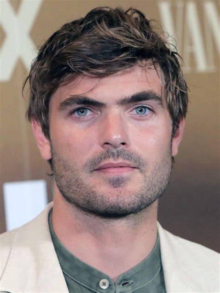 Alex Roe with his dog as seen in June 2016