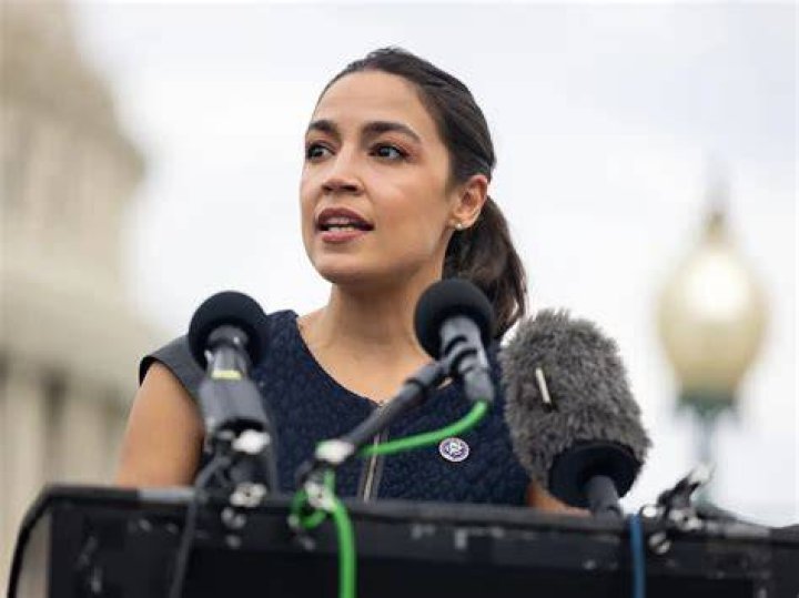 Alexandria Ocasio-Cortez (Left) as seen while talking with Kerri Evelyn Harris in September 2018