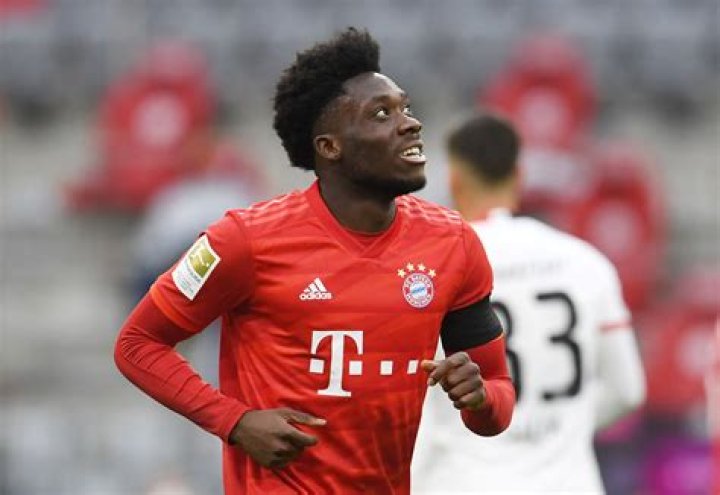 Alphonso Davies with the Bundesliga Trophy in May 2019