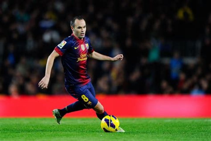 Andres Iniesta dribbling the ball