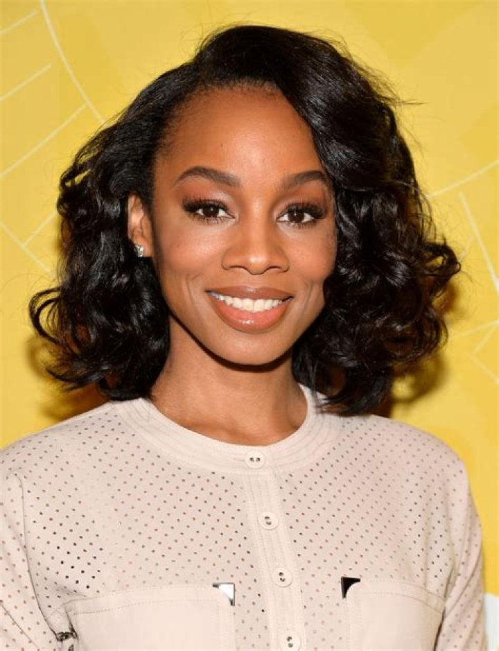 Anika Noni Rose smiling for a picture at the 69th Annual Peabody Awards Luncheon at Waldorf Astoria Hotel New York on May 17, 2010