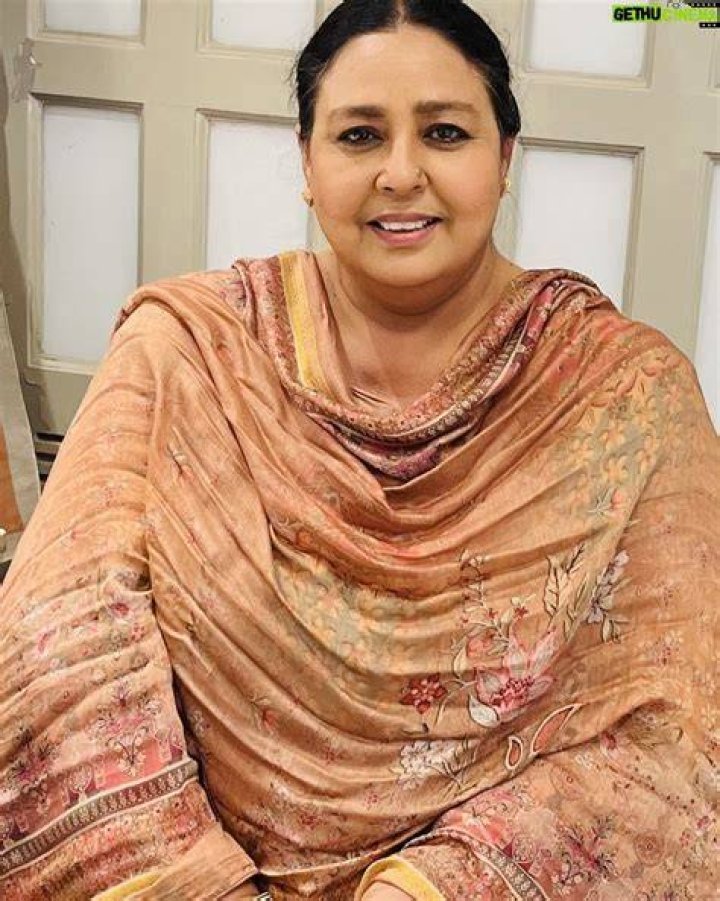 Anita Devgan smiling for a picture with Mehtab Virk