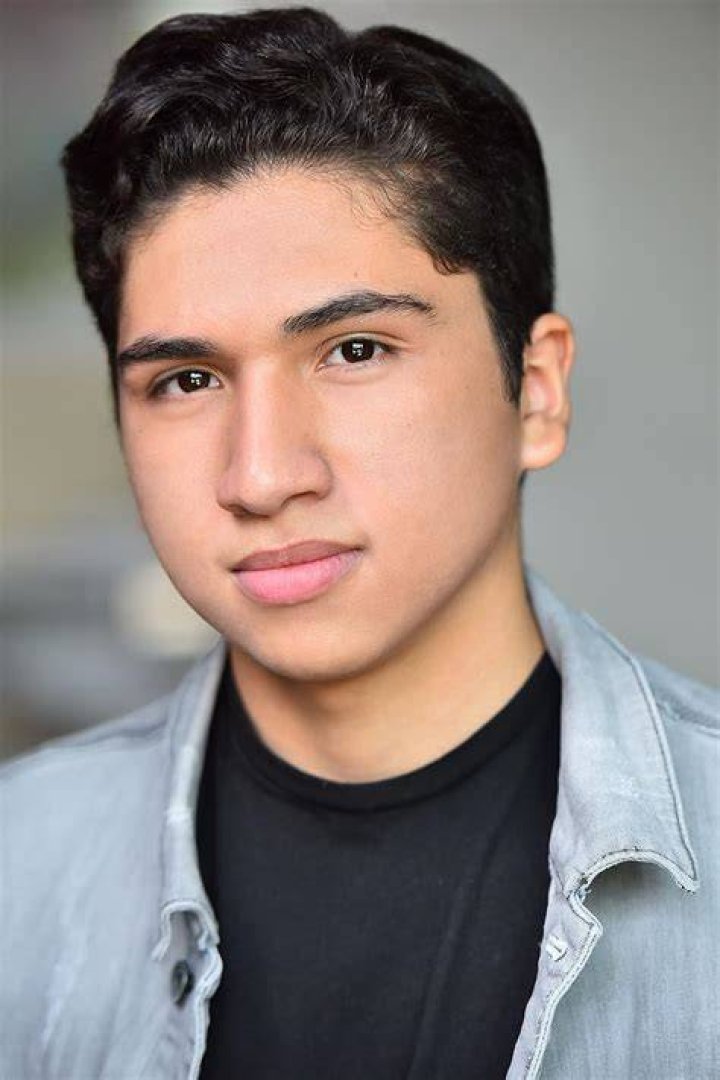 Anthony Gonzalez posing for a picture along with Auli'i Cravalho in August 2019