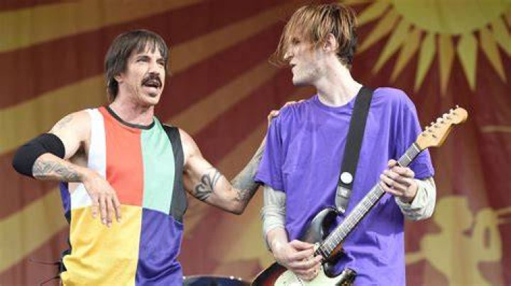 Anthony Kiedis and Josh Klinghoffer (background) during a Red Hot Chili Peppers Concert in July 2011