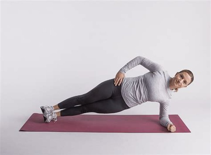Ashley Borden doing side plank for love handles