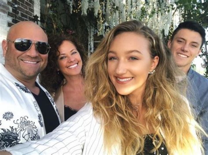 Ava posing with her family Jeanette Cota, Jason Drenner, and brother Devon Cota in May 2019