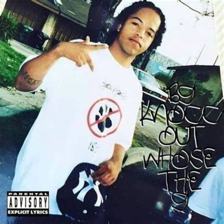 B.G. Knocc Out posing for a picture