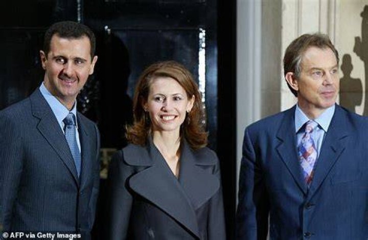 Bashar al-Assad (Left), pictured while wearing the 'Grand Collar' of the National Order of the Southern Cross, accompanied by Brazilian President Luiz In&aacute;cio Lula da Silva in Bras&iacute;lia on June 30, 2010