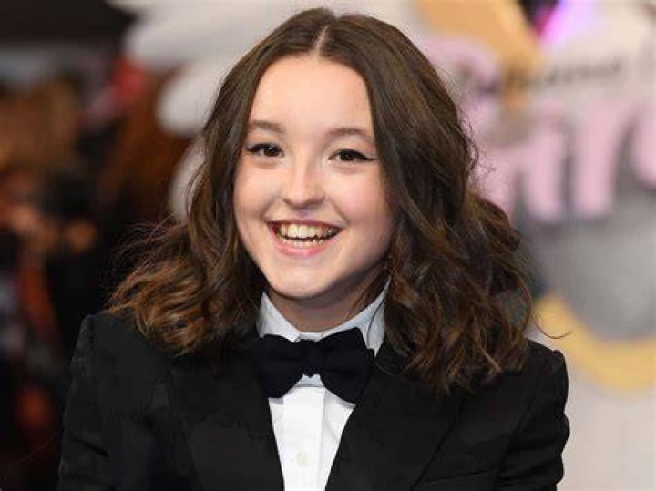 Bella Ramsey smiling for a picture in November 2019