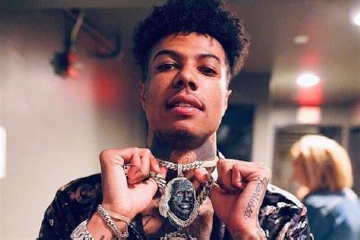 Blueface as seen while posing for the camera showing his chain in July 2019