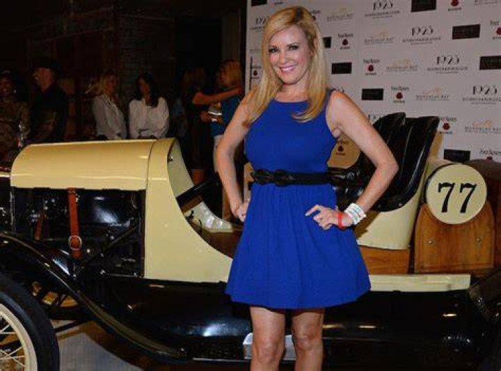 Bridget Marquardt poses in front of a 1923 Ford Model T racing car as she attends the grand opening of 1923 Bourbon & Burlesque by Holly Madison at the Mandalay Bay Resort and Casino on May 1, 2014.