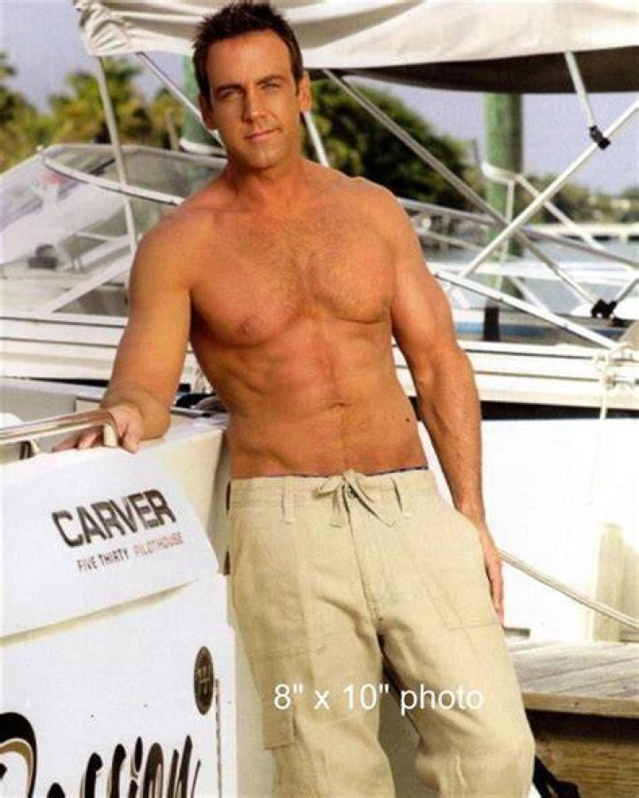 Carlos Ponce posing shirtless at Le Blanc Spa Resort Los Cabos in Mexico