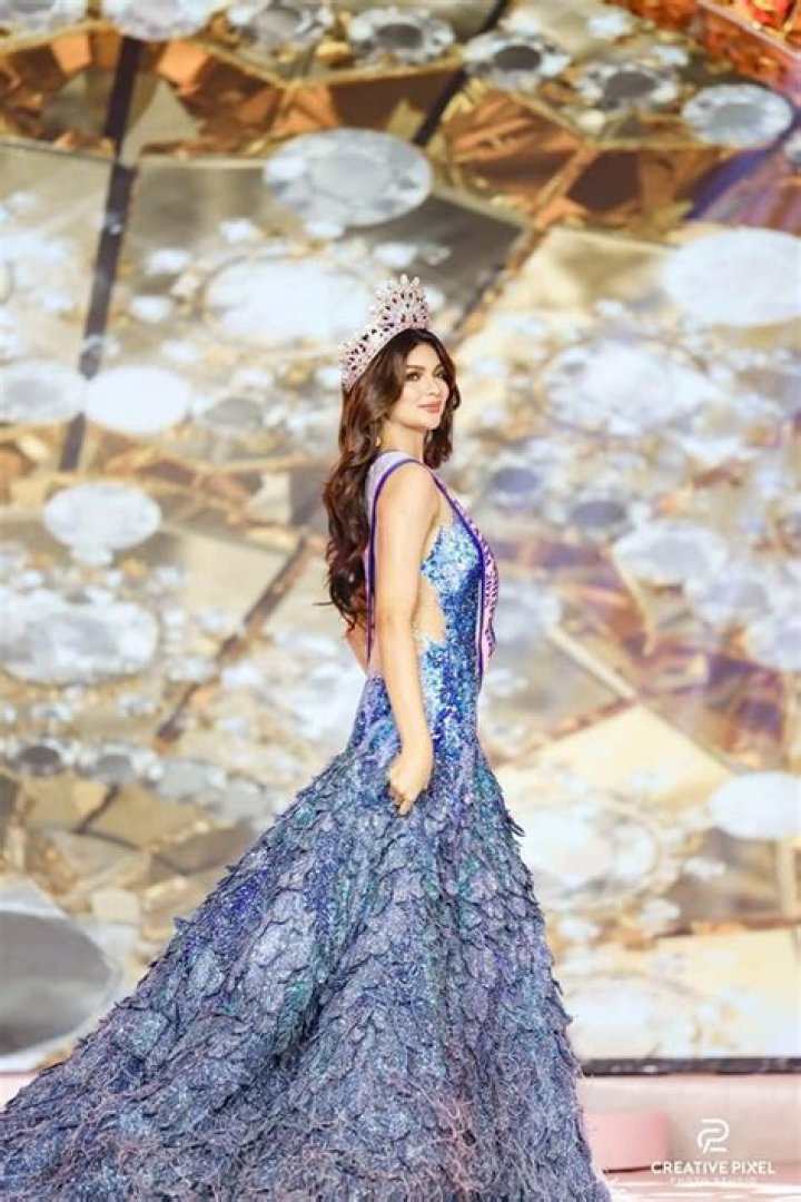 Catriona Gray wearing the iconic tri-star and sun earpiece with a Swarovski gem embellished Mayon gown by designer Mak Tumang