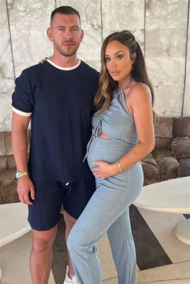 Charlotte Letitia Crosby and Stephen Bear wearing hats from HIS & HERS in June 2017