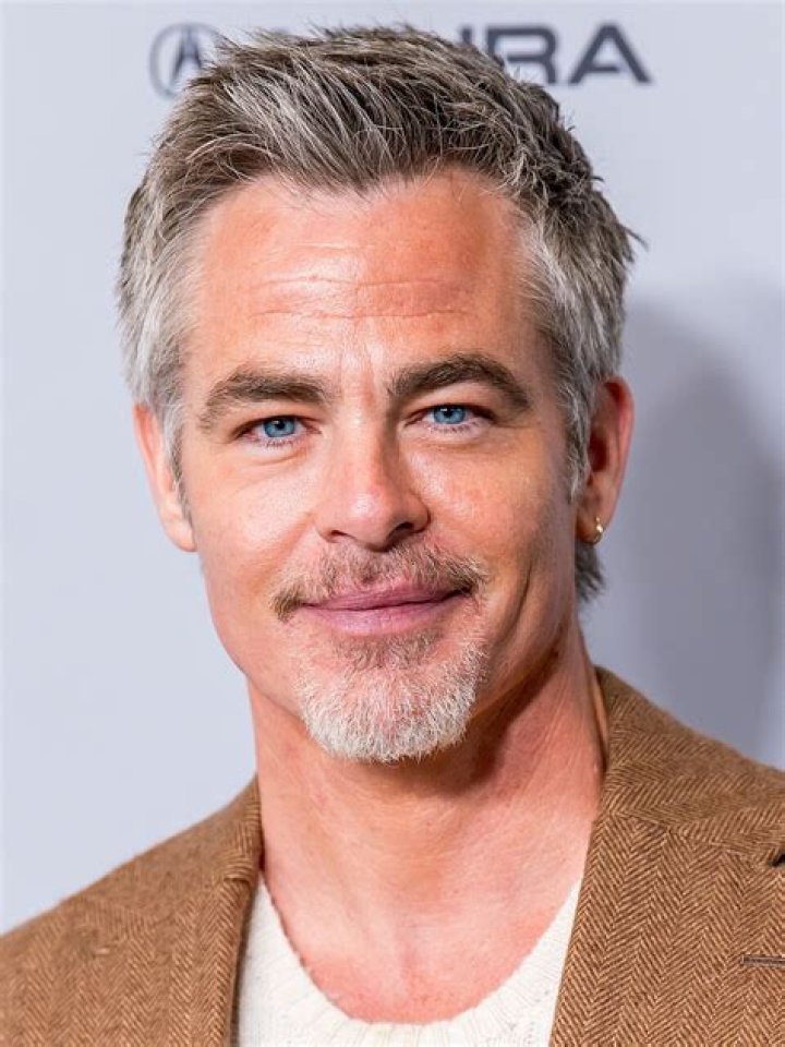 Chris Pine in white t-shirt and blue denims