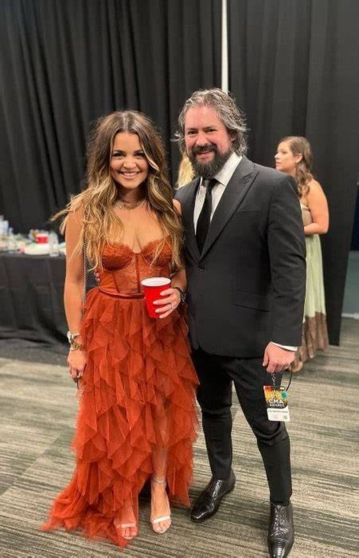 Clay Cook smiling for a picture with Brooke Ellen in November 2022