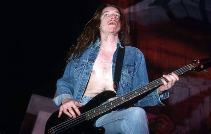 Cliff Burton (Left) with his bandmates