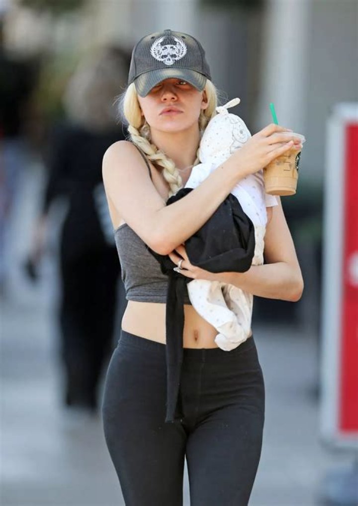 Courtney Stodden holding a baby guitar