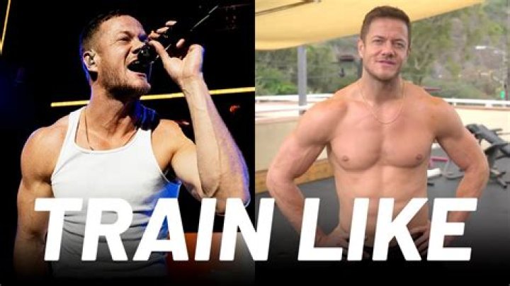 Dan Reynolds doing yoga in a park in July 2018