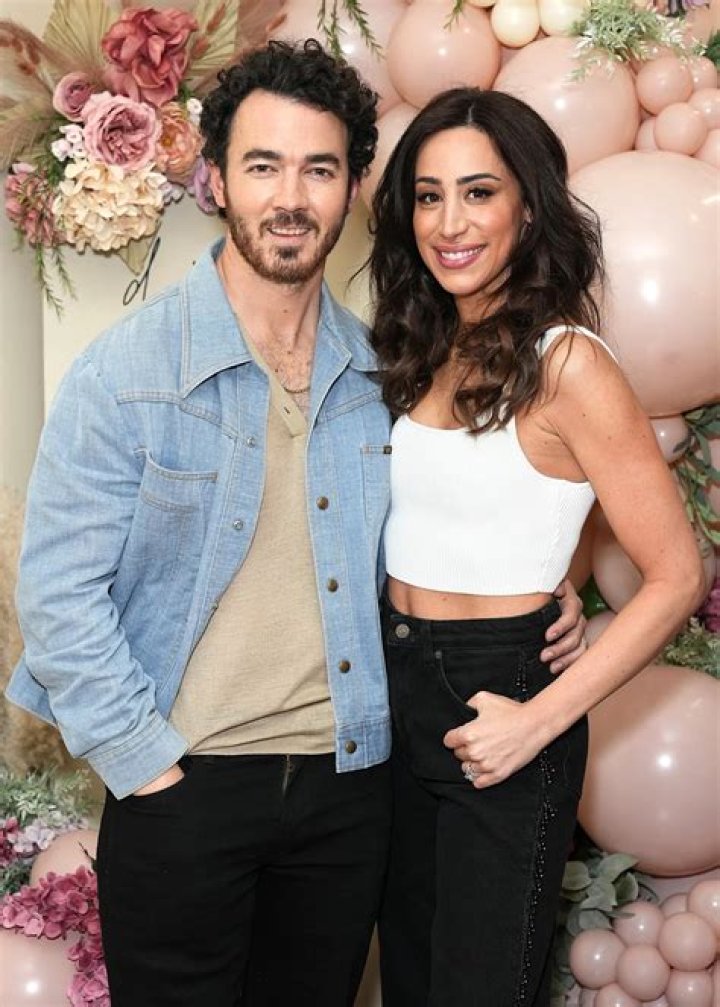 Danielle Jonas shows off her stunning bikini body while holding daughter Alena in September 2015