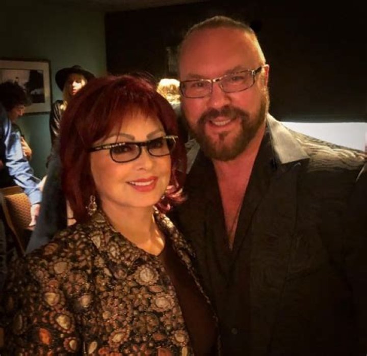 Desmond Child and Naomi Judd posing for a picture