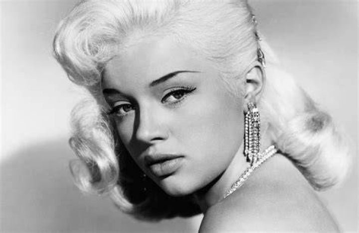 Diana Dors as seen in a cropped screenshot from the trailer for the film 'The Unholy Wife'