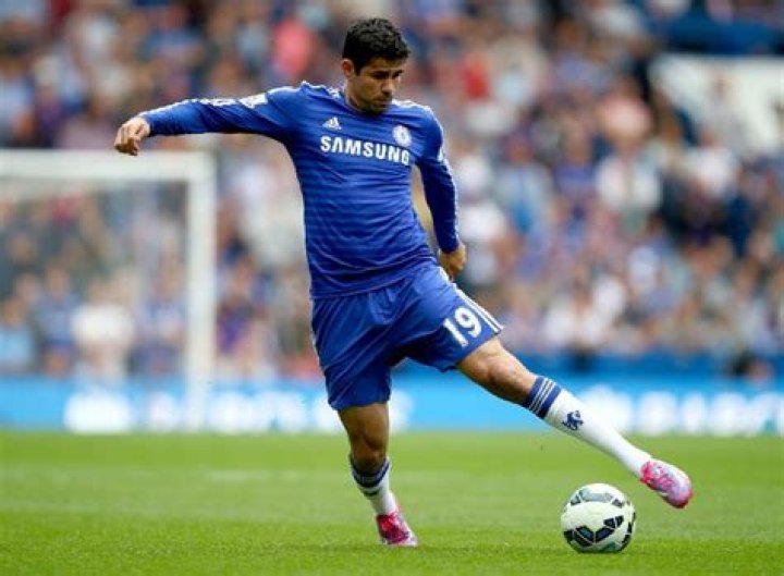 Diego Costa kicking the ball towards the target
