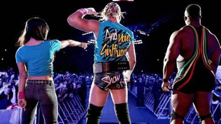 Dolph Ziggler, flanked by AJ Lee (left) & Big E Langston (right), preps for a match against Alberto Del Rio on WWE RAW on Februay 18, 2013