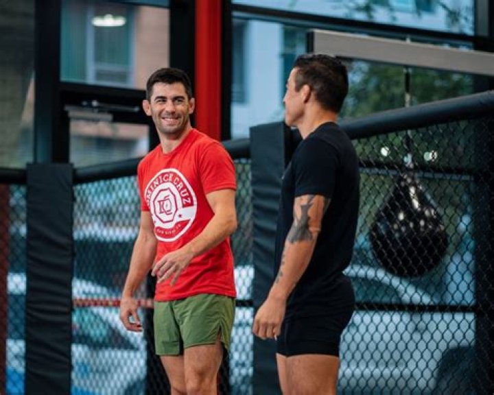 Dominick Cruz with Orlando Jimenez (Right) and Brendan Loughnane (Left) in Tucson, Arizona in September 2018
