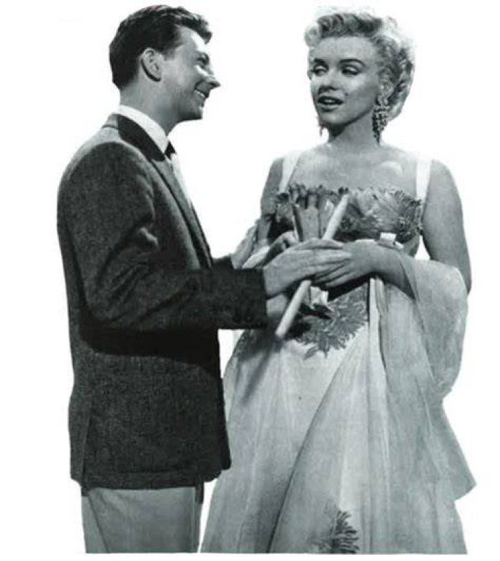 Donald O'Connor, Debbie Reynolds, and Gene Kelly seen in a lobby card for the film Singin' in the Rain