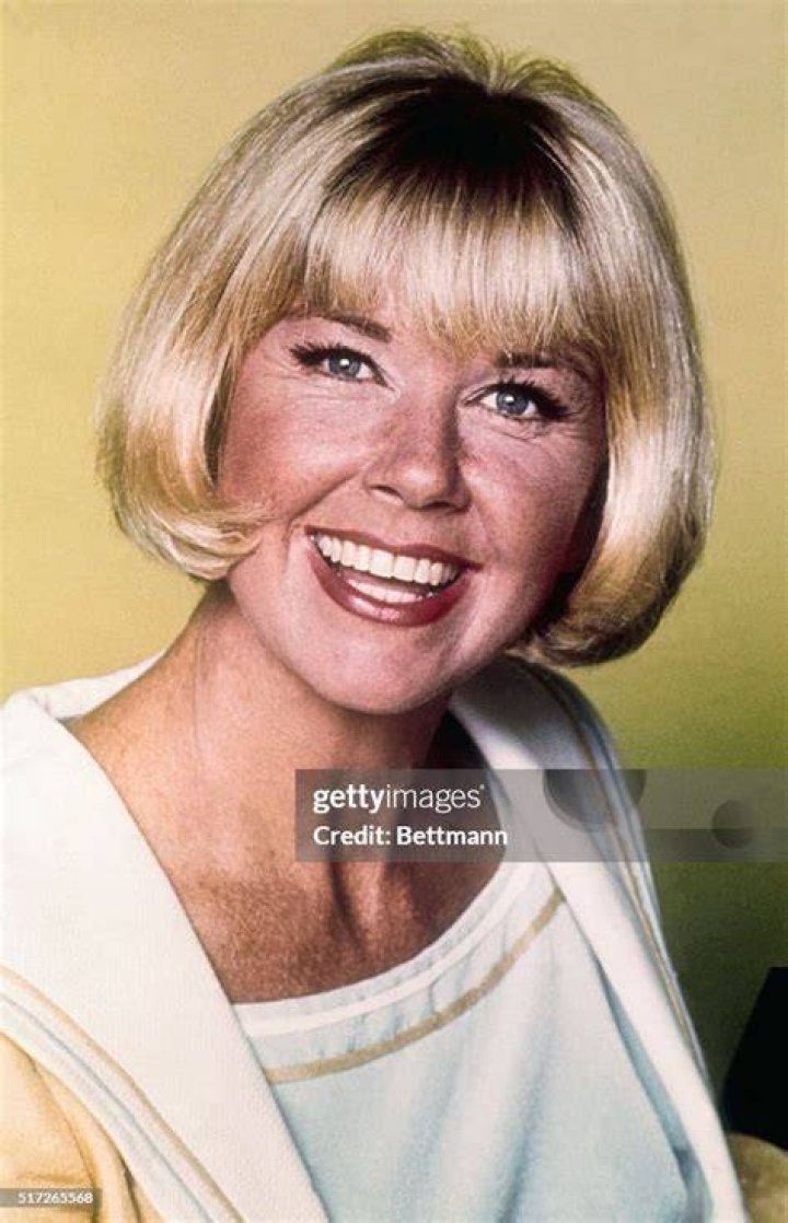 Doris Day smiling in a black-and-white picture taken in November 1957