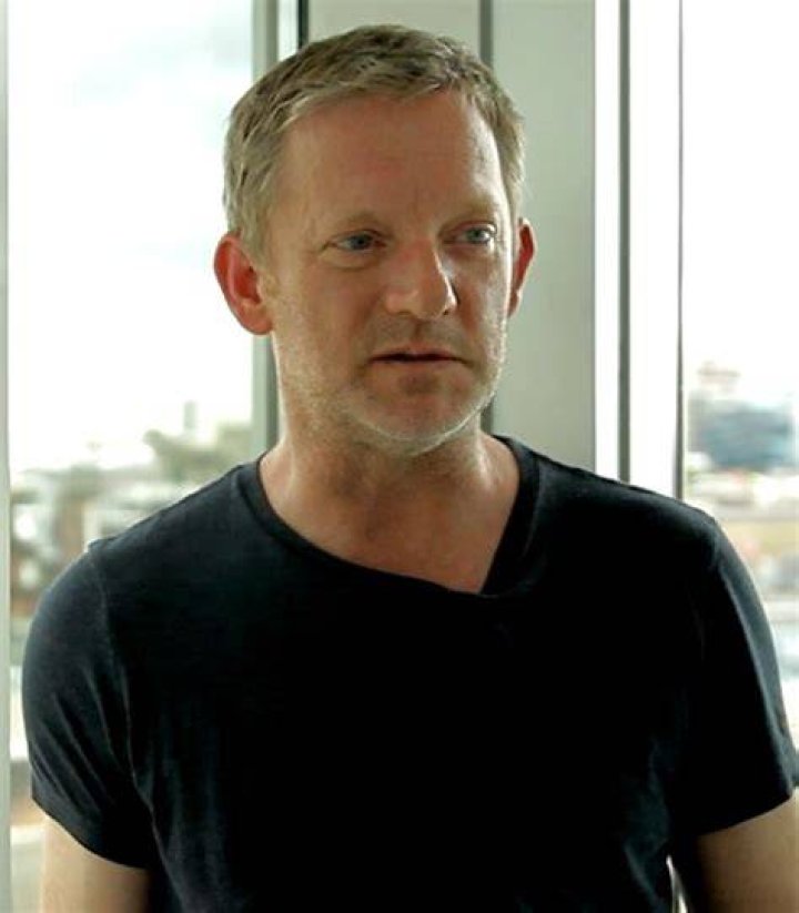 Douglas Henshall posing for a photograph with a fan, in March 2018