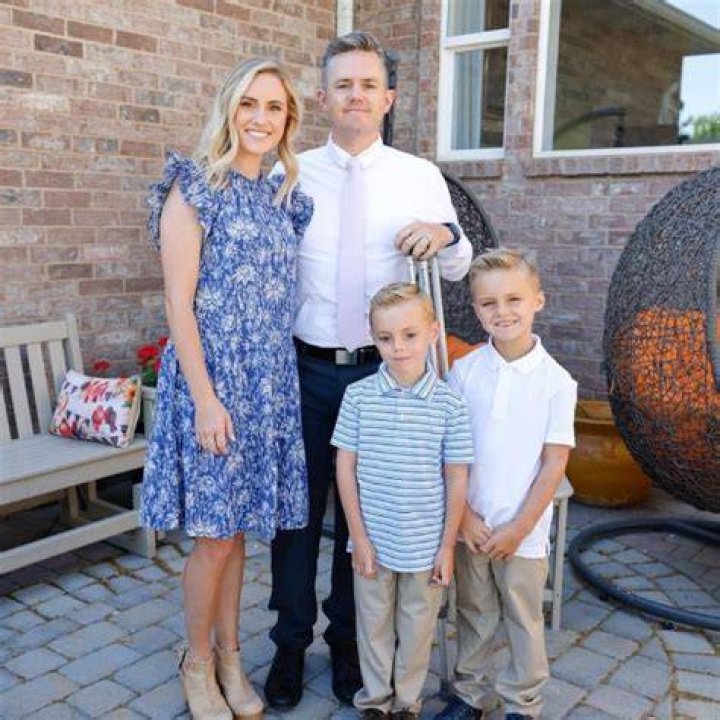 Ellie Mecham in a picture that was taken alongside her husband Jared Mecham and their children Calvin and Jackson in June 2021