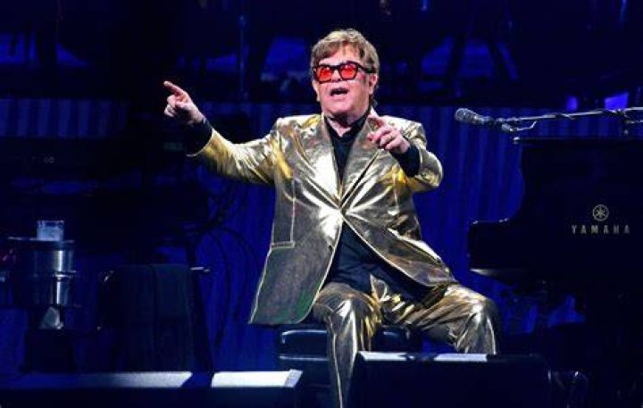 Elton John performing in a concert during his All the Hits Tour 2015