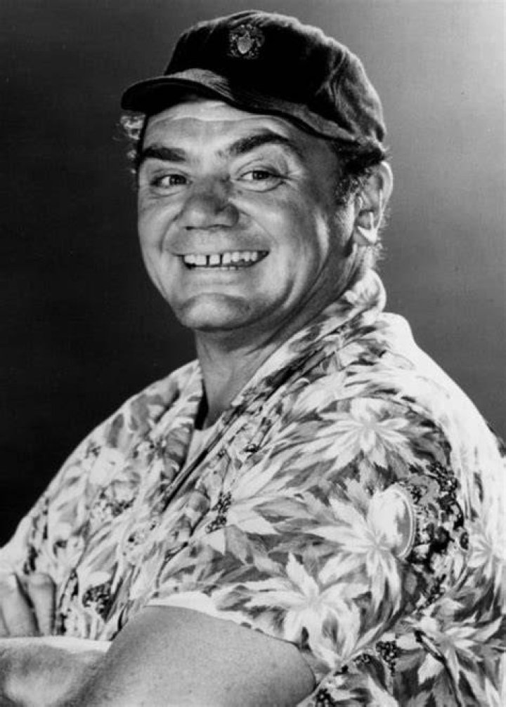 Ernest Borgnine as seen in a black-and-white picture while receiving academy award for 'Marty' from Grace Kelly in March 1956
