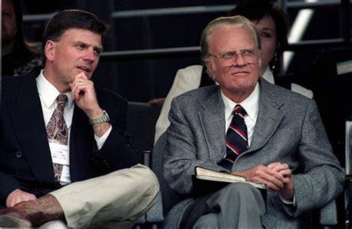 Franklin Graham as seen sitting with his father Billy Graham in Cleveland in 1994