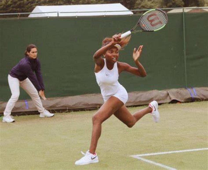 Fran&ccedil;oise Abanda in action during a match at the 2017 Wimbledon Championships