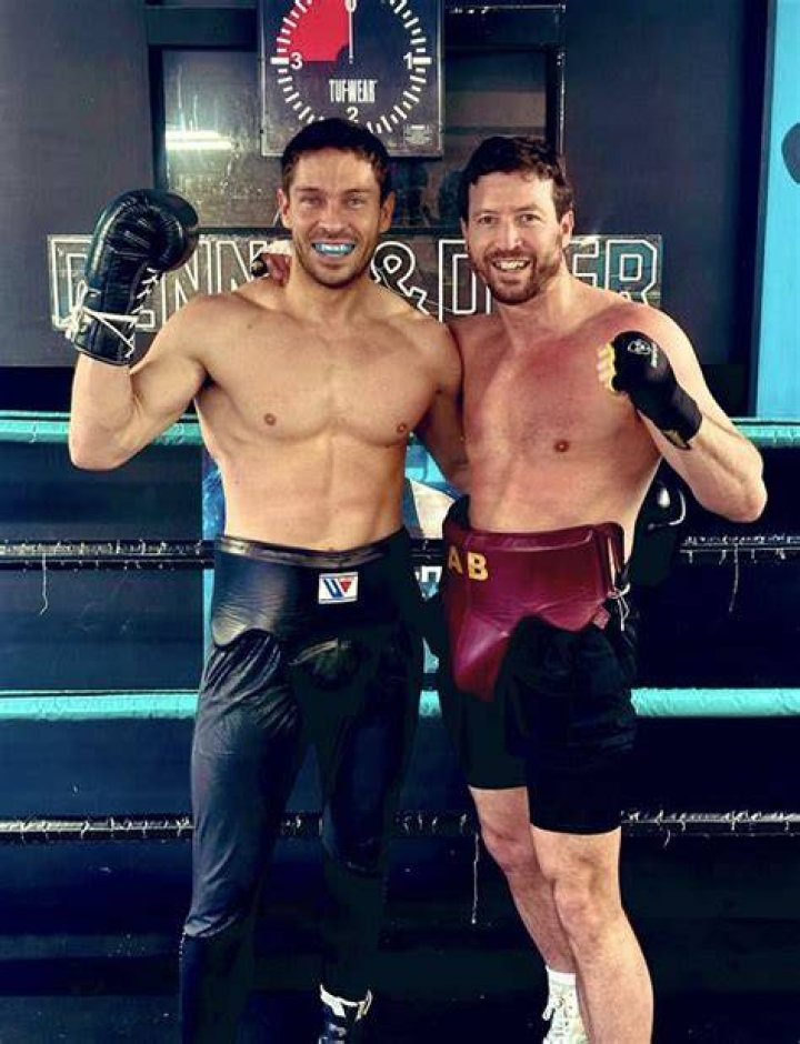 Geoff Ramsey posing shirtless alongside Emily Hatfield in December 2019