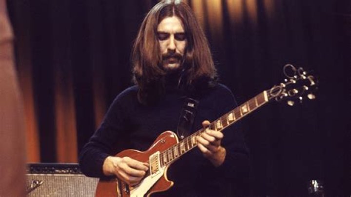 George Harrison as seen while leaving the Hilton Hotel in Amsterdam and signing an album for a fan in February 1977