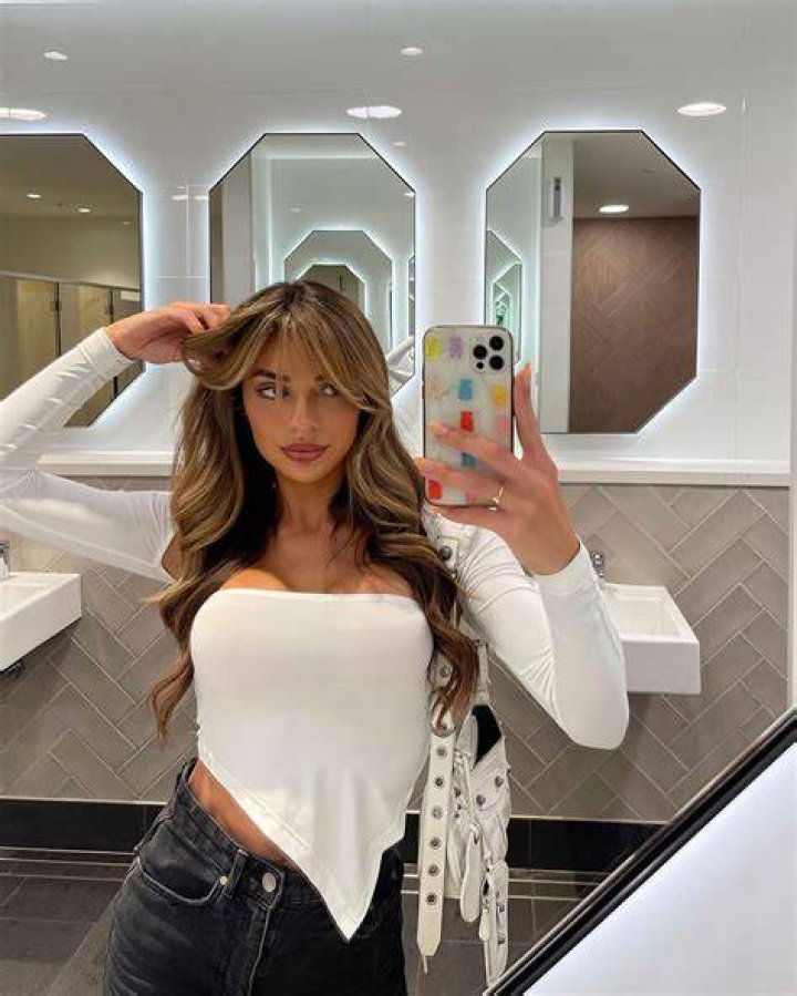 Georgia Hassarati in a selfie with her puppy Crisbo that was taken in December 2021, Australia