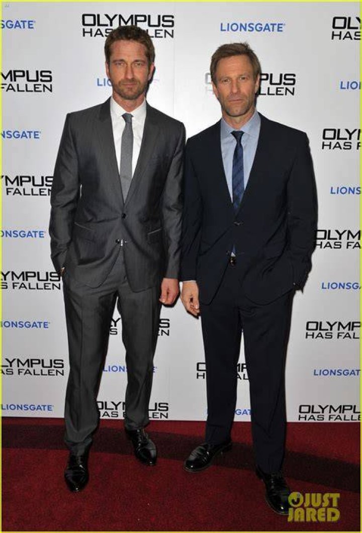 Gerard Butler (Left) and Aaron Eckhart during the photocall for their film "Olympus Has Fallen" in 2013