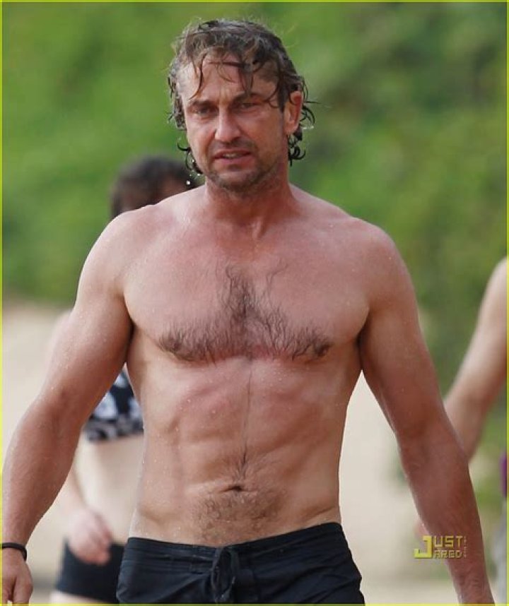 Gerard Butler shirtless at a beach in Malibu