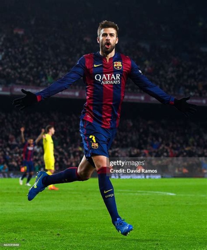 Gerard Pique of FC Barcelona and Shakira pose with the trophy after FC Barcelona won the Copa del Rey Final match against Athletic Club at Camp Nou