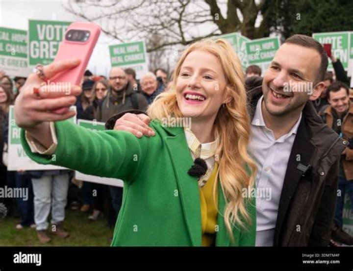 Hannah taking a selfie with her parents and brother Patrick in July 2019