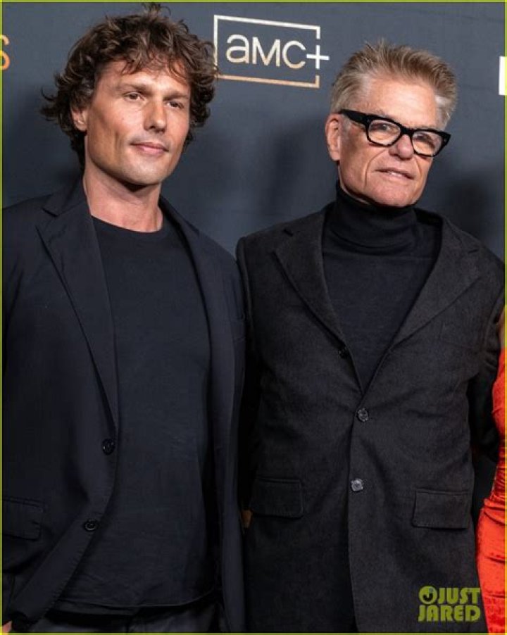 Harry Hamlin posing for the camera along with then-wife, Laura Johnson at the 1987 Emmy Awards