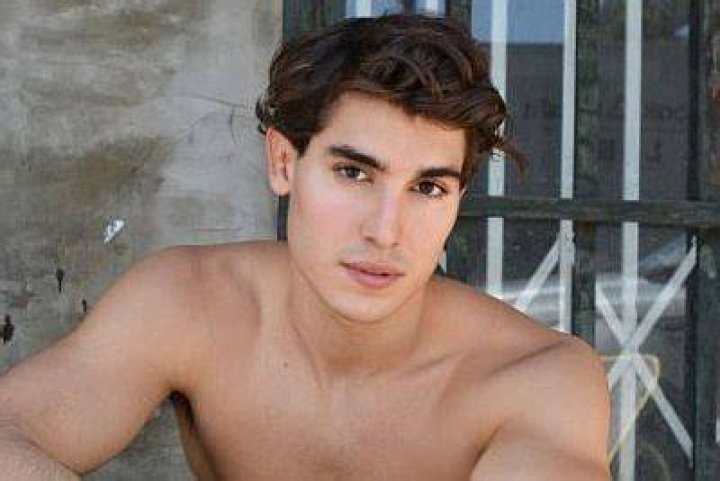 Henry Zaga posing shirtless for a picture at Lake Powell, Utah in August 2020